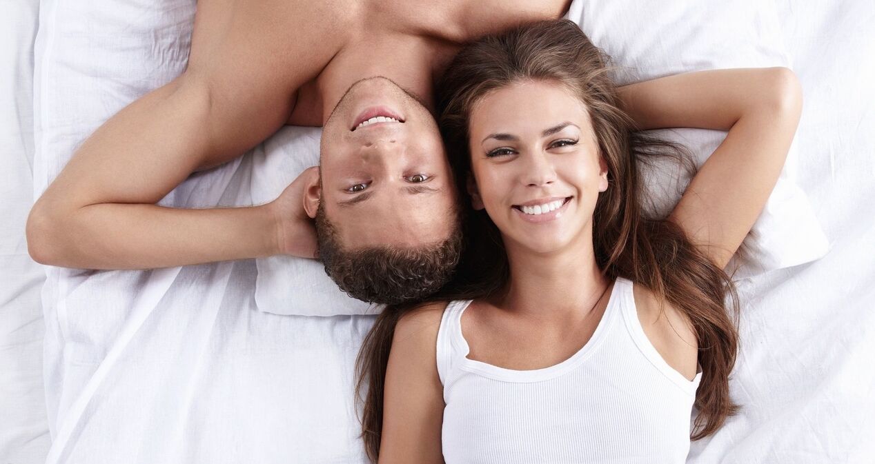 a woman in bed with a man having increased power