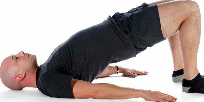 A man performing the Arch exercise to improve strength